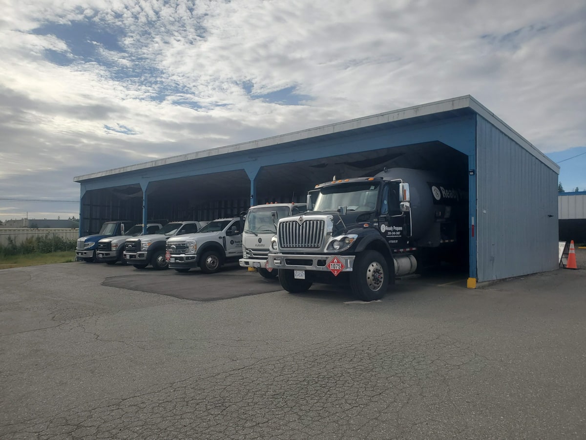 Fleet of trucks under a shelter