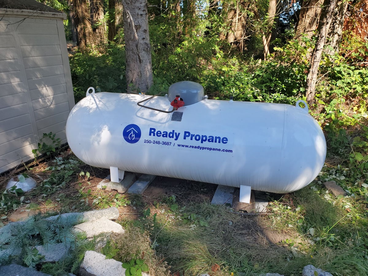 Propane tank in a wooded area