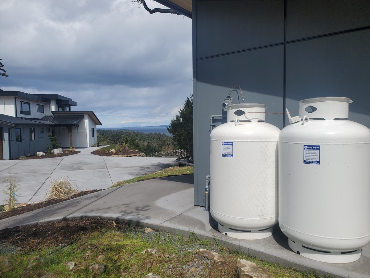 Two propane tanks beside modern house