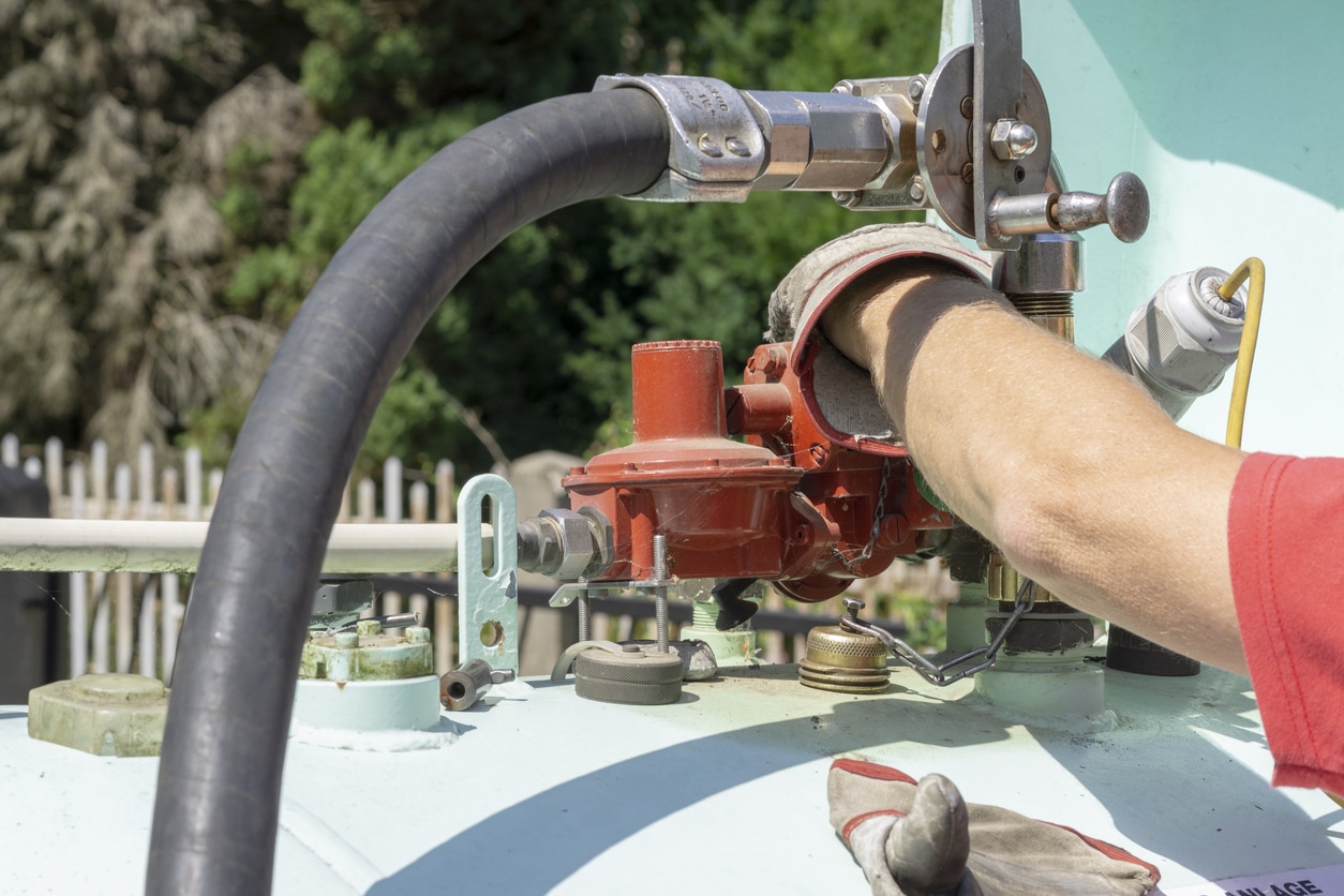 how to check your propane tank level image person with propane tank