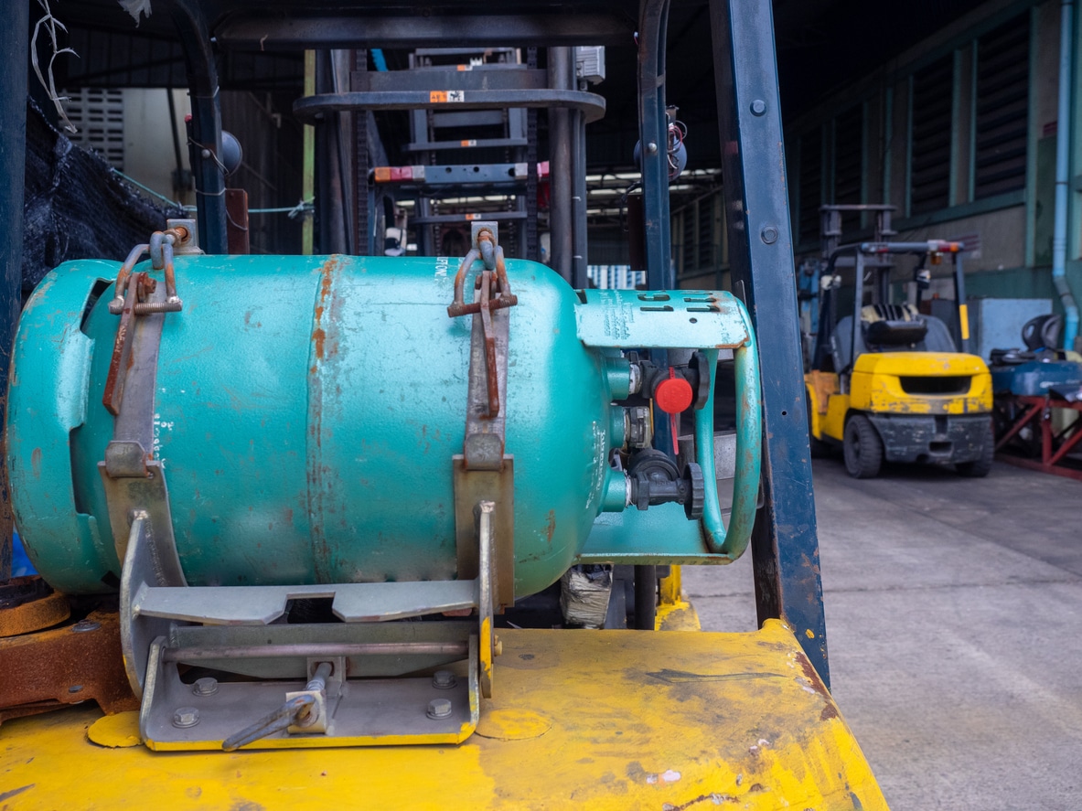 Forklift with gas cylinder in warehouse